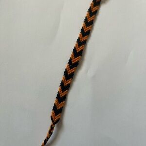 Handcrafted Black and Orange Woven Bracelet